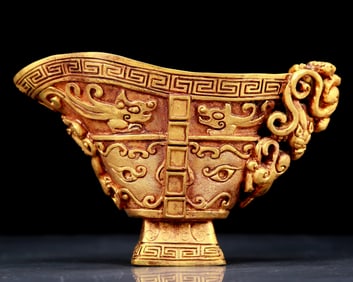 An exquisite gilt bronze cup with dragon pattern