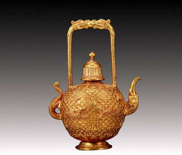 An Exquisite Gilt Bronze Auspicious Cloud and Dragon Pattern Pattern Teapot: An Exquisite Gilt Bronze Auspicious Cloud and Dragon Pattern Pattern Dragon-Handle Teapot,Qing Dynasty, China,Size:10cmx17cm,Weight:665g &#38108;&#37775;&#37329;&#31077;&#20113;&#40857;&#32441;&#40857