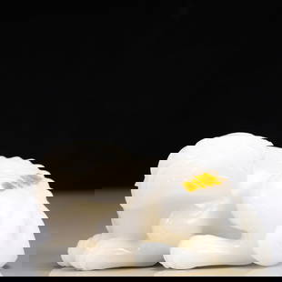 An Exquisite White Jade Lion Ornament: An Exquisite White Jade Lion Ornament Qing Dynasty, China Size:12cmx8cmx6.5cm Weight:939g白玉狮子摆件