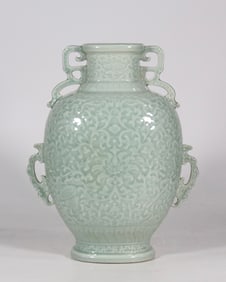 An Exquisite Celadon Glazed Lotus Pattern Eight Treasures Pattern Vase
