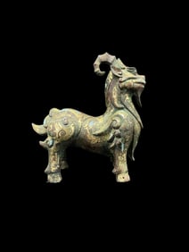 An Archaic Bronze Ram Inlaid with Gold and Silver