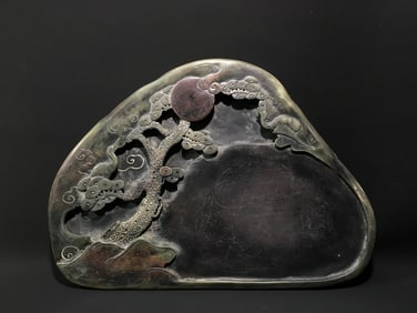 A Rare Jade belt relief pine and crane pattern inkstone