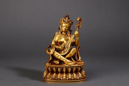 A Rare Copper Gilt Pipa-Holding Guanyin Statue Ornament