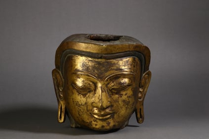 A Rare Copper Gilt Wealth Deity Buddha Head Ornament