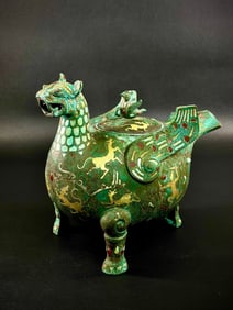 An Archaic Bronze Zun in Winged Phoenix-Beast Form, Gold Silver Inlay
