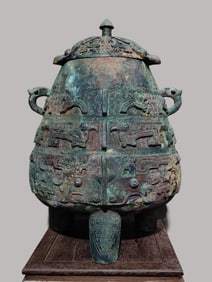 An Archaic Bronze Lei with Owl-Taotie Motifs on Three Legs