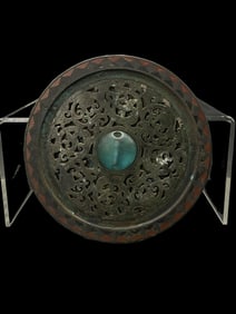 An Archaic Bronze Mirror with Openwork Coiling Dragon Design