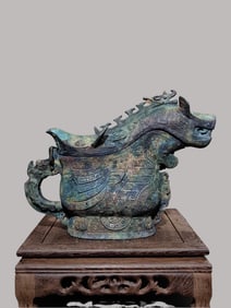 An Archaic Bronze Zoomorphic Gong Vessel