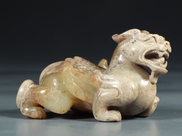 An Archaic Gaogu Jade Auspicious Beast Ornament