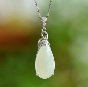 An Exquisite Sterling Silver Inlaid White Jade Pendant