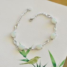 An Exquisite Sterling Silver Inlaid White Jade Bracelet