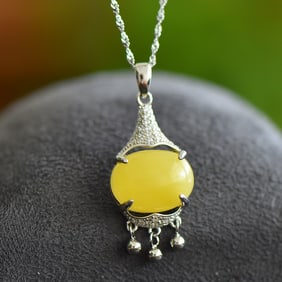 An Exquisite Sterling Silver Inlaid Amber Pendant