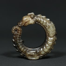 An Exquisite White Jade Dragon Pendant