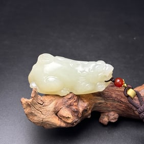 An Exquisite White Jade Auspicious Beast Pendant