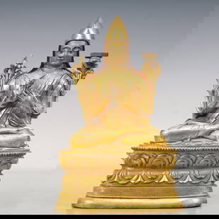 An Excellent Gilt-Bronze Figure Of Tsongkapa: An Excellent Gilt-Bronze Figure Of Tsongkapa. The figure with a dignified expression is rendered clad in long,flowing robes,the voluminous drapery elegantly cascading in folds,topknot surmounted by a