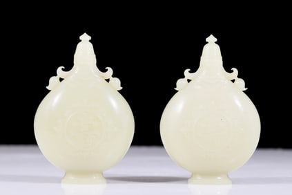 A pair of exquisite white jade amphora with floral patterns