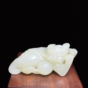 An Exquisite White Jade Lion Hand Piece