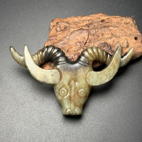 An Exquisite White Jade Buffalo-head Pendant