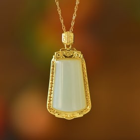 An Exquisite Sterling Silver-Gold Plated Inlaid White Jade Pendant