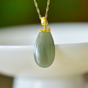 An Exquisite Sterling Silver Inlaid Greenish Jade Pendant