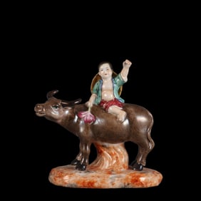 A Rare Famille Rose Figure of Shepherd Boy Riding Yellow Ox