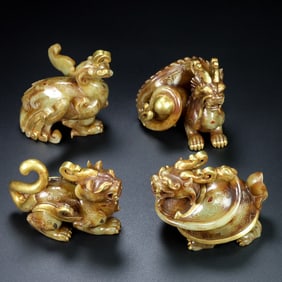 A set of Rare ancient jade inlaid gold four divine beasts