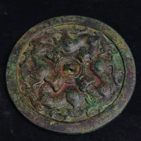 An Archaic Bronze four-beast mirror