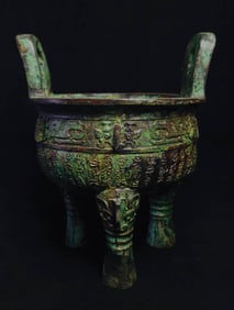 An Archaic Bronze inscripted three-legged ding