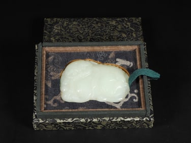 An Exquisite White Jade Lion Ornament