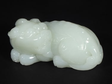An Exquisite White Jade Auspicious Beast Ornament