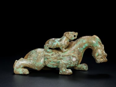 An Exquisite Archaic Jade Auspicious Beast Ornament
