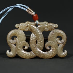 An Exquisite Archaic Jade Dragon Pendant