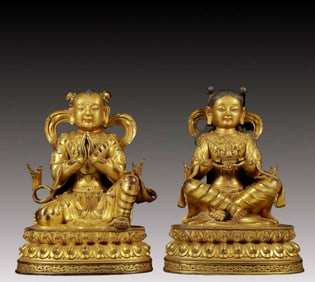 Two solemn gilt bronze figures