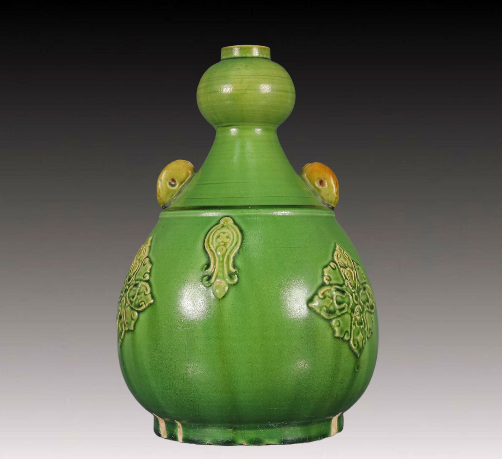 An Exquisite Tang Tri-Color Glazed Pottery Flower Pattern Double-Ears Vase: An Exquisite Tang Tri-Color Glazed Pottery Flower Pattern Double-Ears Vase,Tang Dynasty,China,Size:6.7inx6.7inx9.4in,Weight:950g 唐三彩花卉纹双耳瓶