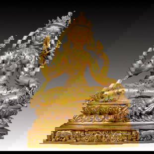 A solemn gilt bronze statue of green Tara inlaid with sapphires: solemn gilt bronze statue of green Tara Ming Dynasty,China. Tara has an elegant posture with a peaceful and compassionate expression. Her face is soft and solemn,and her eyes are warm. She seems to be