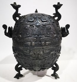 An Archaic Bronze Taotie Pattern Tripod Cover Jar