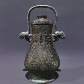 An Archaic Bronze Double-Ears Ewer
