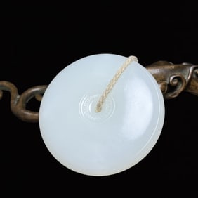 An Exquisite White Jade Pendant