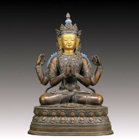 A Solemn Gilt Bronze Statue of Four-Armed Guanyin