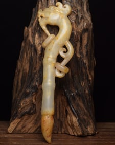 An Exquisite White Jade Dragon-Shaped Ornament