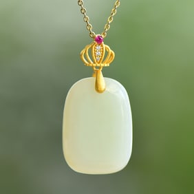 An Exquisite Sterling Silver-Gold Plated Inlaid White Jade Pendant