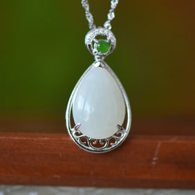 An Exquisite Sterling Silver Inlaid White Jade Pendant