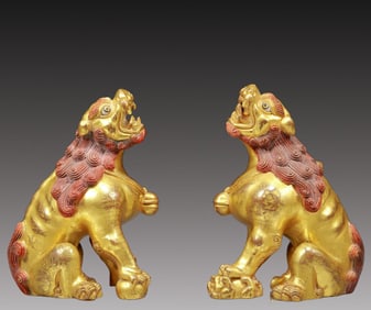 A Pair of Rare Gilt Bronze Lion Ornaments