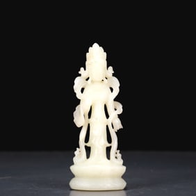 An exquisite white jade standing statue of Guanyin