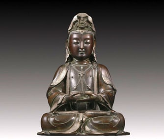 A Brilliant Silver-Bronze Figure Of Guanyin