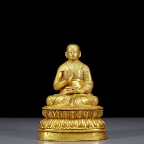 A Solemn Gilt Bronze Statue of Guru