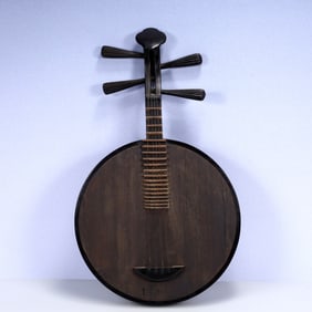 A Rare Wooden Qin Ornament