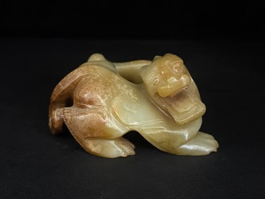 An Exquisite White Jade Auspicious Beast Ornament