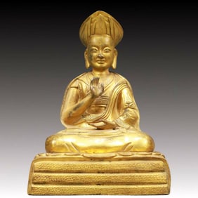 A Solemn Gilt Bronze Statue of Guru