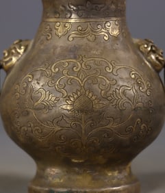 A Rare Gilt Bronze Flower, Auspicious Cloud and Dragon Pattern Ewer